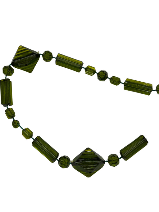 Necklace with green beads on a white background