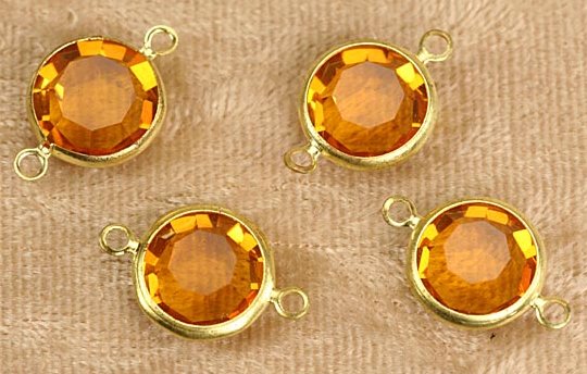 Swarovski Channel Set Stones 11mm (47ss)  Topaz with 2 loop  1 gross for