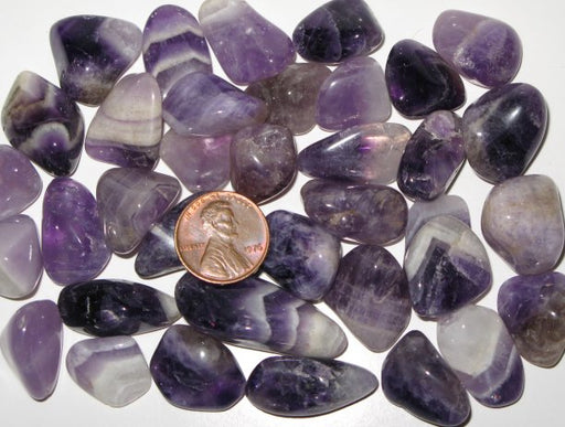 Tumbled amethyst nuggets.    1 pound for